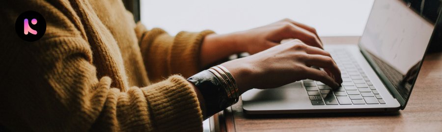 Close-up of hands typing on a laptop, representing task and message alerts arriving across separate apps.